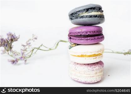 colorful macaroon cakes against white background