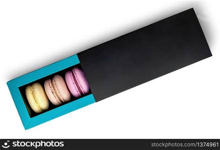 Colorful macaroon in box top view on white background. Colorful macaroon in box top view