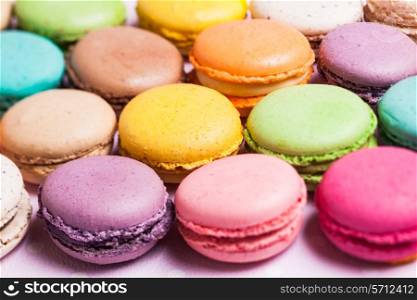 Colorful macaroons - french dessert as a background