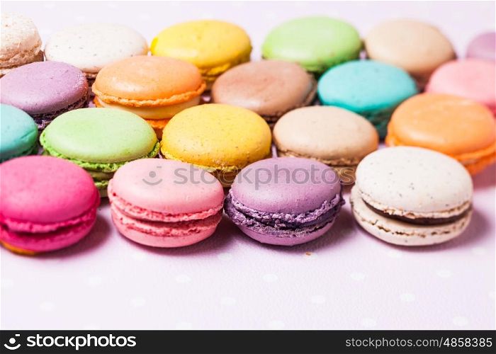 Colorful macaroons - french dessert as a background. The Colorful macaroons