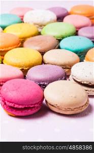 Colorful macaroons - french dessert as a background. The Colorful macaroons