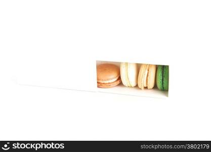 Colorful macaroons in a white box