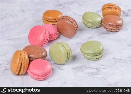 Colorful macaroons on marble background, top view vintage color style