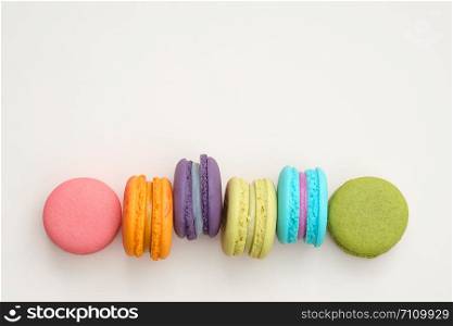 colorful macaroons on pink background, Sweet and tasty for cooking and restaurant menu, Dessert beautiful, Top view, Space to write. pastel colors, vintage card.