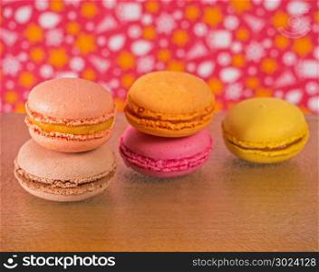 Colorful macaroons on wooden background. Assorted traditional french dessert