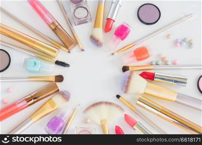 Colorful make up flat lay close up scene on white background. Colorful make up flat lay scene