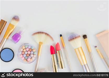 Colorful make up flat lay scene border with copy space. Colorful make up flat lay scene