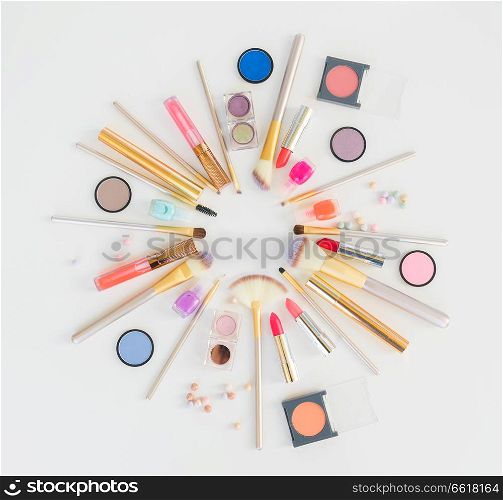 Colorful make up flat lay scene on white background. Colorful make up flat lay scene