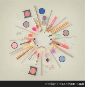 Colorful make up flat lay scene on white background, retro toned. Colorful make up flat lay scene