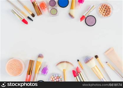 Colorful make up flat lay scene with copy space. Colorful make up flat lay scene