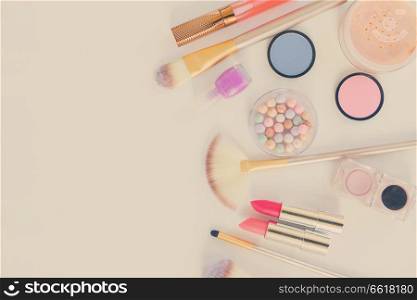 Colorful make up flat lay scene with copy space, retro toned. Colorful make up flat lay scene