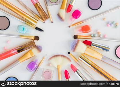 Colorful make up flat lay top view scene on white background. Colorful make up flat lay scene
