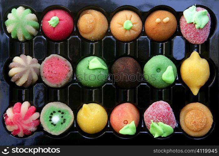 Colorful marzipan sweets with fruits shapes