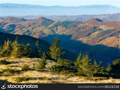 Colorful mountain slopes in autumn morning Carpathian.