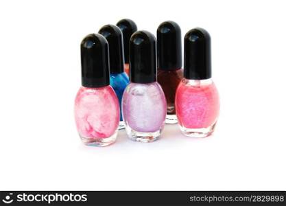 Colorful nail polishes isolated on white background.