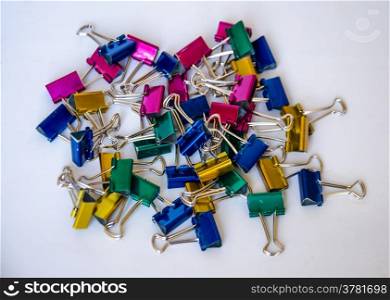 colorful of metal paper clip on white background