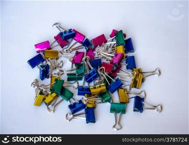 colorful of metal paper clip on white background