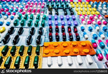 Colorful of tablets and capsules pill in blister packaging arranged with beautiful pattern. Pharmaceutical industry concept. Pharmacy drugstore. Antibiotic drug resistance and drug use with reasonable