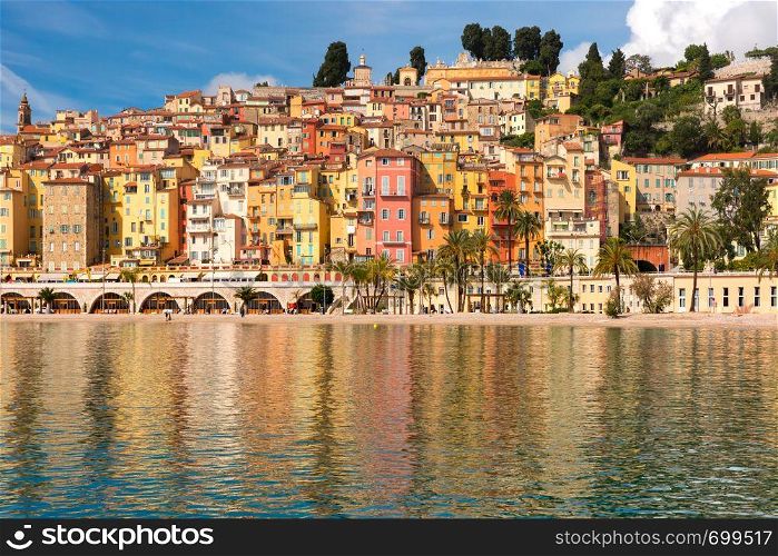 Colorful old town and beach in sunny Menton, perle de la France, on French Riviera, France. Menton, French Riviera, France
