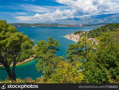 Colorful old village of Novigrad in Istria county of Croatia with blue river and harbor seen from the fortress. Picturesque small riverside town of Novigrad in Croatia