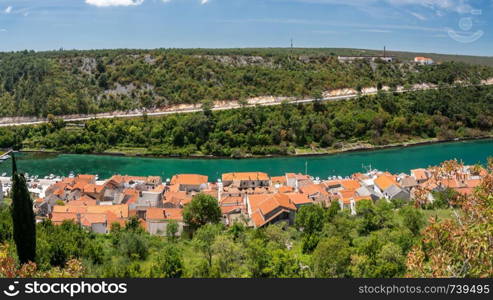 Colorful old village of Novigrad in Istria county of Croatia with blue river and harbor seen from the fortress. Picturesque small riverside town of Novigrad in Croatia