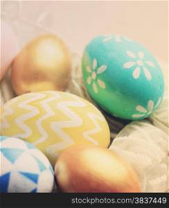 Colorful painted easter eggs with retro filter effect