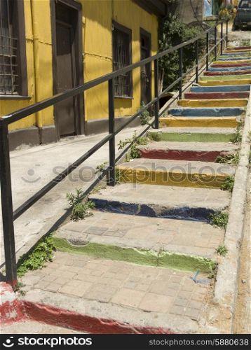 Colorful painted steps along house, Valparaiso, Chile