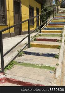Colorful painted steps along house, Valparaiso, Chile