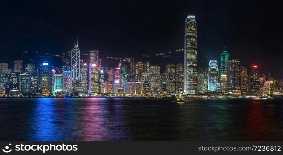 Colorful panoramic view of Hong Kong skyline on night time seen from Kowloon. Hong Kong, China.. Colorful panoramic view of Hong Kong skyline on night time seen from Kowloon.