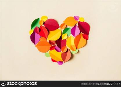 Colorful paper autumn leaves forming heart shape. Flat lay. Beautiful Autumn season. School time. Paper art and hancrafting. Colorful paper autumn leaves