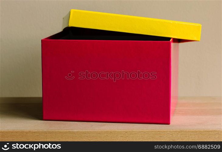 colorful paper box on wooden table