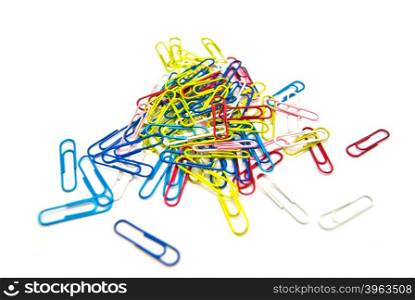 colorful paper clips close-up on white background