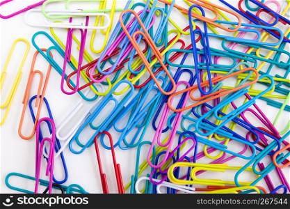 Colorful paper clips decorative on white desktop background, Abstract, Office supply concept.