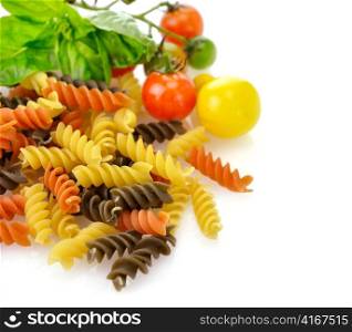 Colorful pasta on white with tomatoes and spices