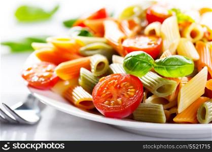 colorful pasta with tomatoes and basil