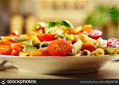 colorful pasta with tomatoes and basil
