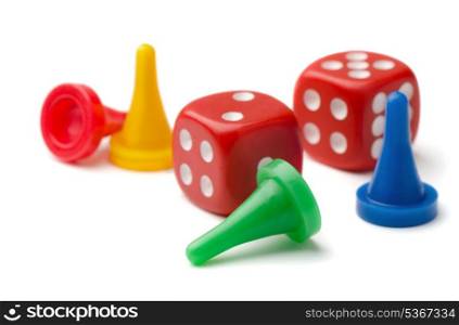 Colorful pawns and dices isolated on white