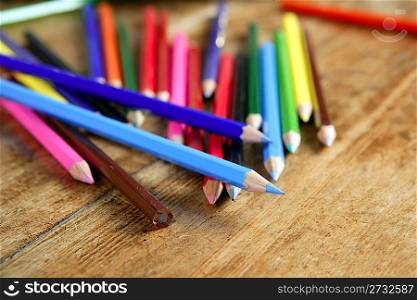 colorful pencil arrangement casual on wooden desk vintage retro