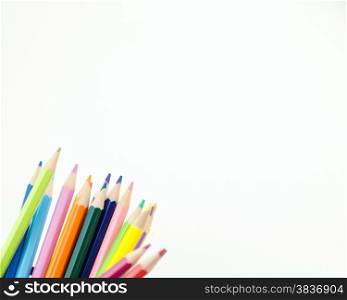 Colorful pencil crayons with copy space