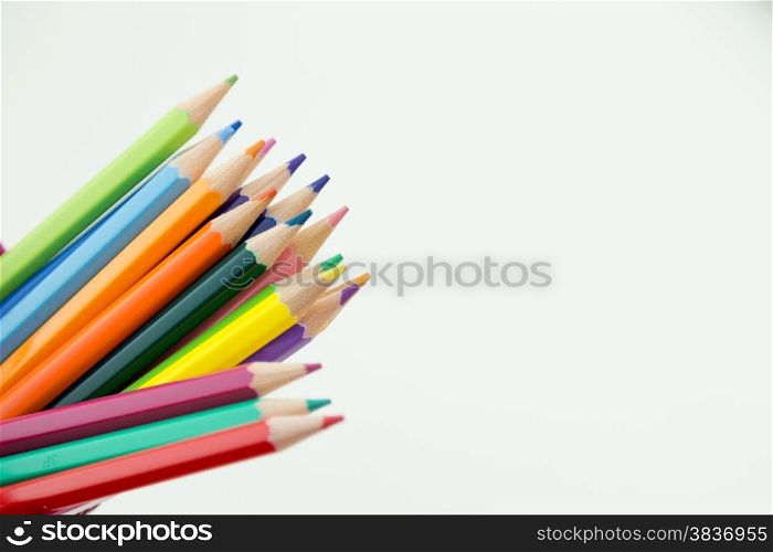 Colorful pencil crayons with copy space