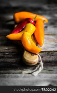 Colorful peppers on rustic background