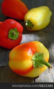 colorful peppers on the wooden background