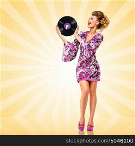 Colorful photo of a clubbing fashionable hippie homemaker holding a retro vinyl record and smiling happily on colorful abstract cartoon style background.