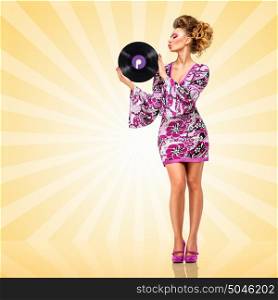Colorful photo of a clubbing fashionable hippie homemaker sending a kiss to a retro vinyl record in her hands on colorful abstract cartoon style background.