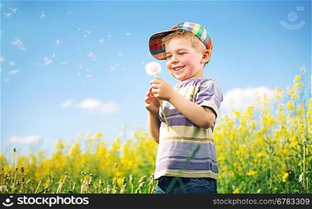Colorful picture of kid playing dandelion