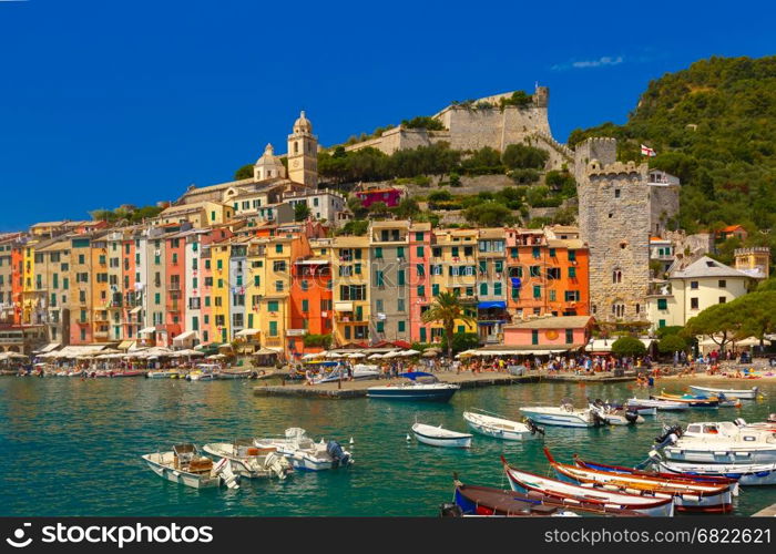 Colorful picturesque harbour of Porto Venere, San Lorenzo church and Doria Castle on the background, La Spezia, Liguria, Italy.