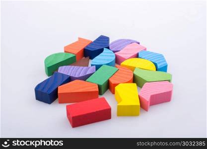 Colorful pieces of a logic puzzle . Colorful wooden pieces of a logic puzzle
