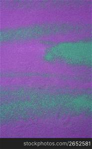 colorful pigments background textures in green and purple salt sand