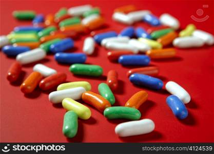 Colorful pill sweets candy with selective focus pattern background
