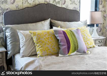Colorful pillow on bed